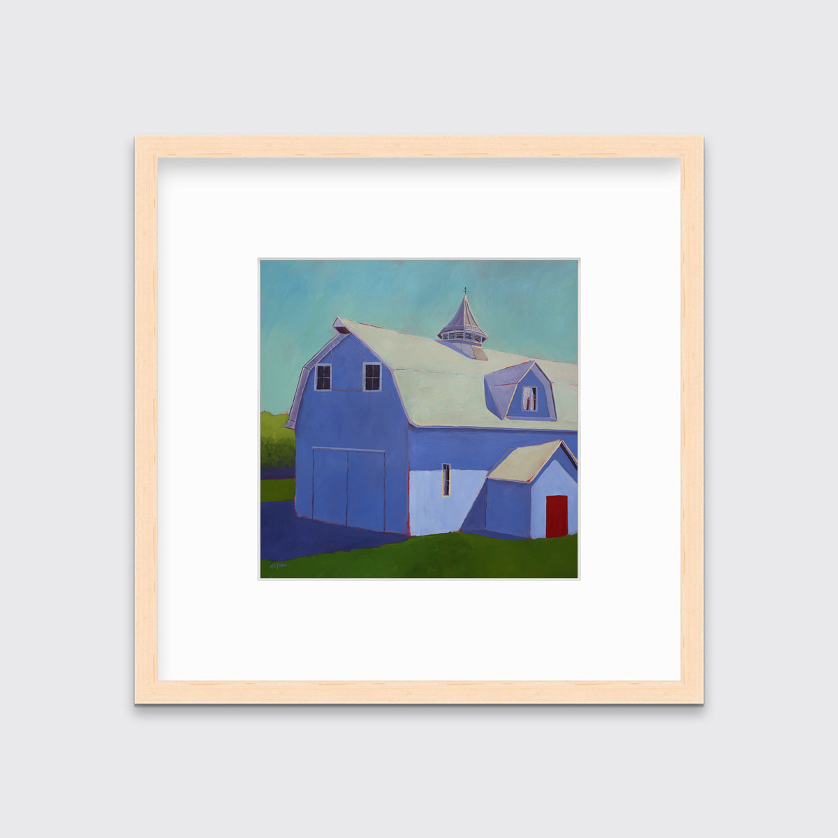 A light blue, lavender and beige contemporary barn print in a natural wood frame with a mat hangs on a white wall.