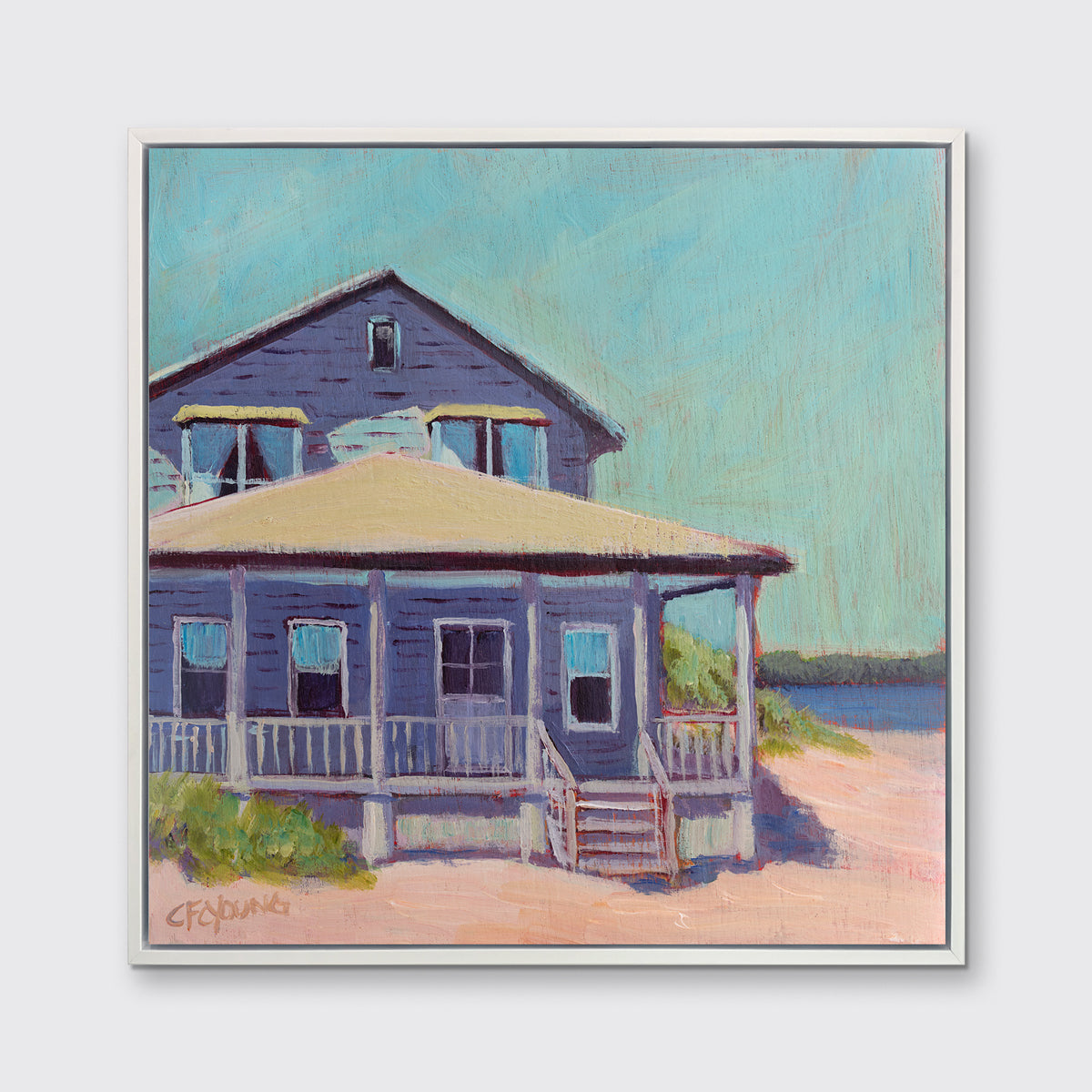 A teal, purple, beige and rose contemporary beach house print in a white floater frame hangs on a white wall.