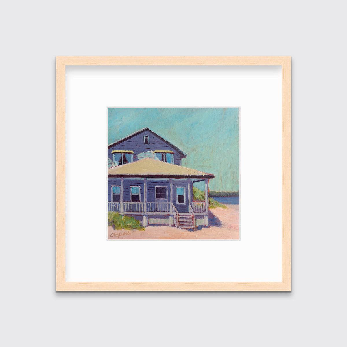 A teal, purple, beige and rose contemporary beach house print in a natural wood frame with a mat hangs on a white wall.