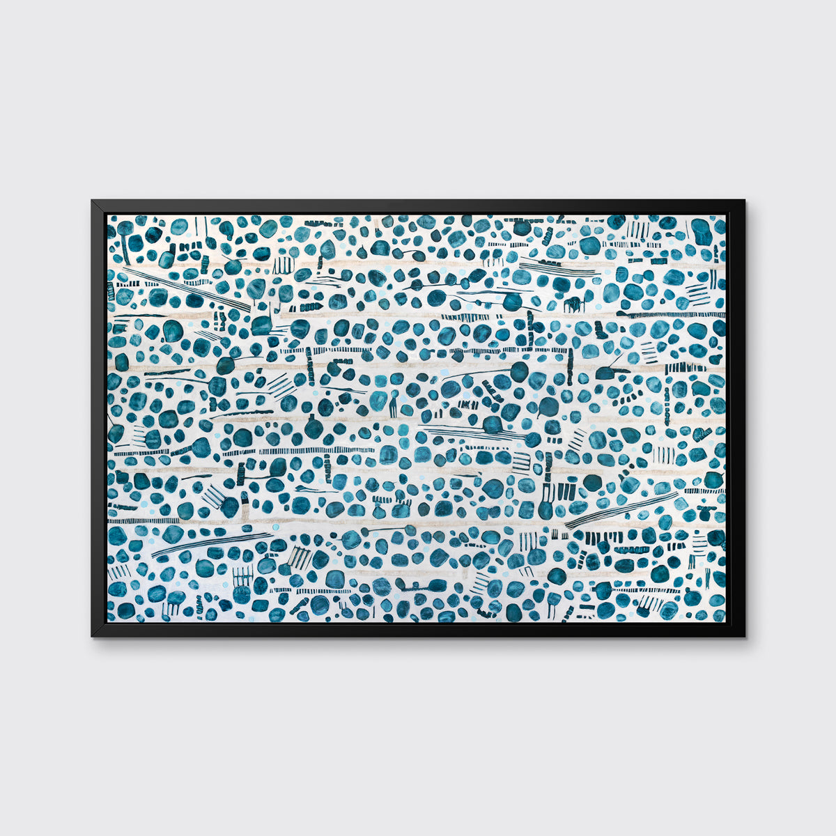 A dark teal, white and beige abstract print in a black floater frame hangs on a white wall.