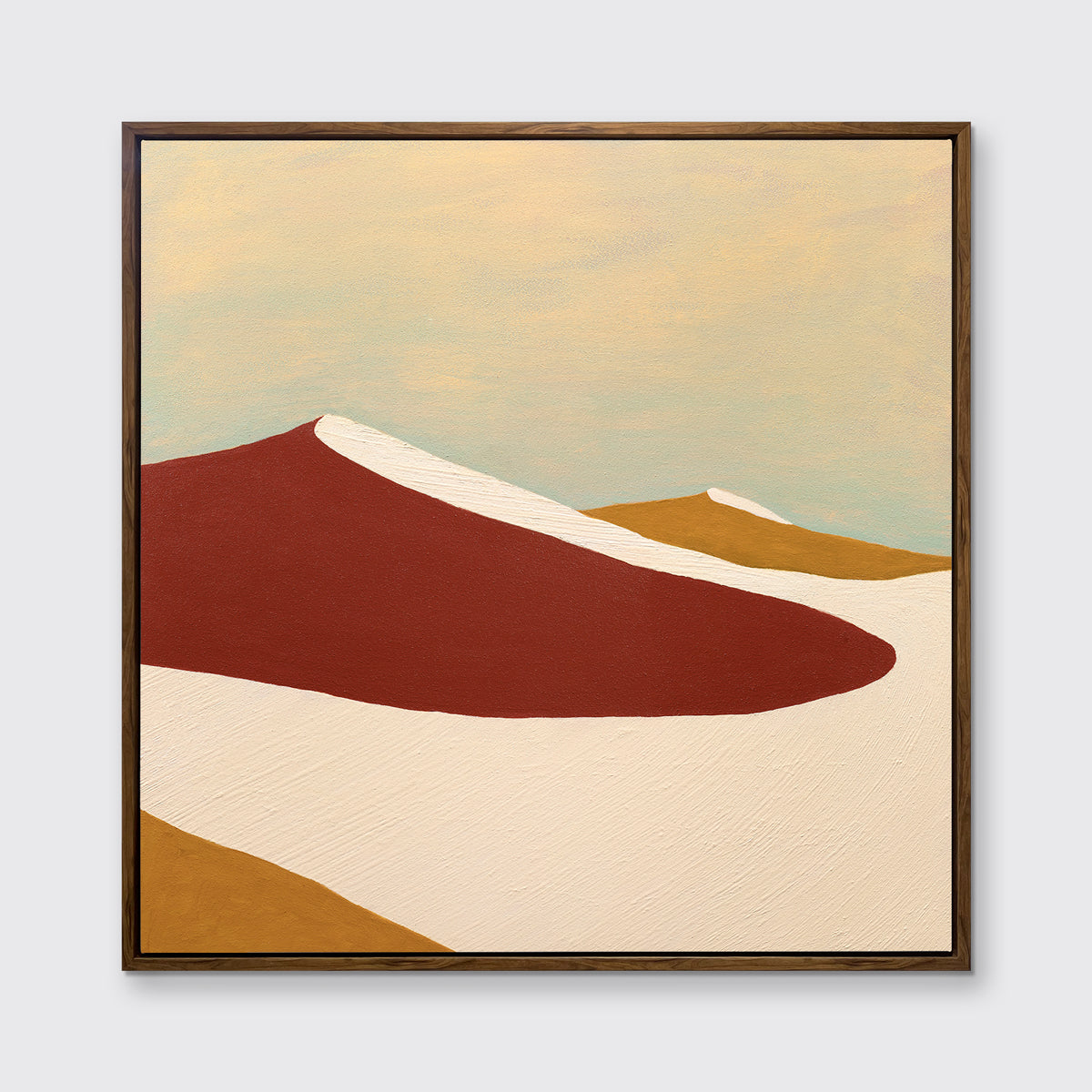 A red, burnt orange and beige abstract print in an oak wood floater frame hangs on a white wall.