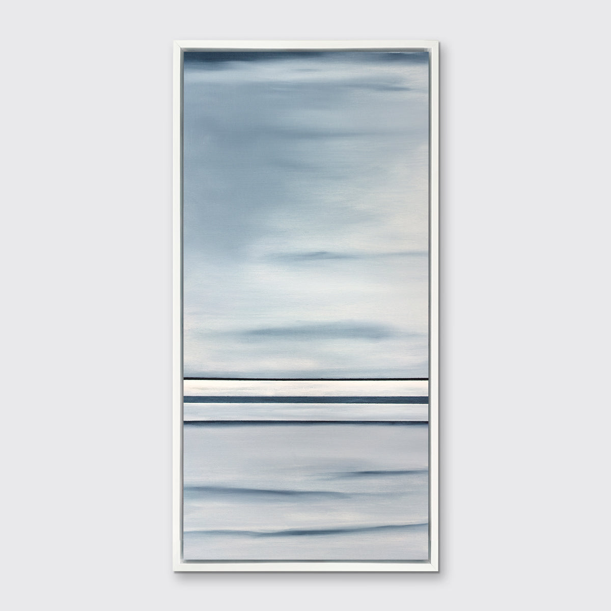 Blue and white abstract print in a white floater frame on a white wall.