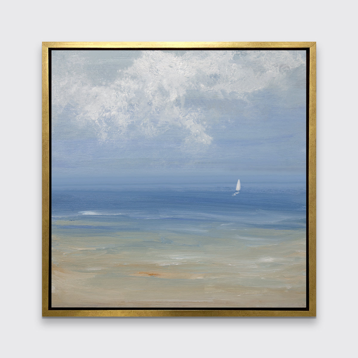 A blue, light green, beige and white abstract seascape print with a small sailboat in a gold floater frame hangs on a white wall.