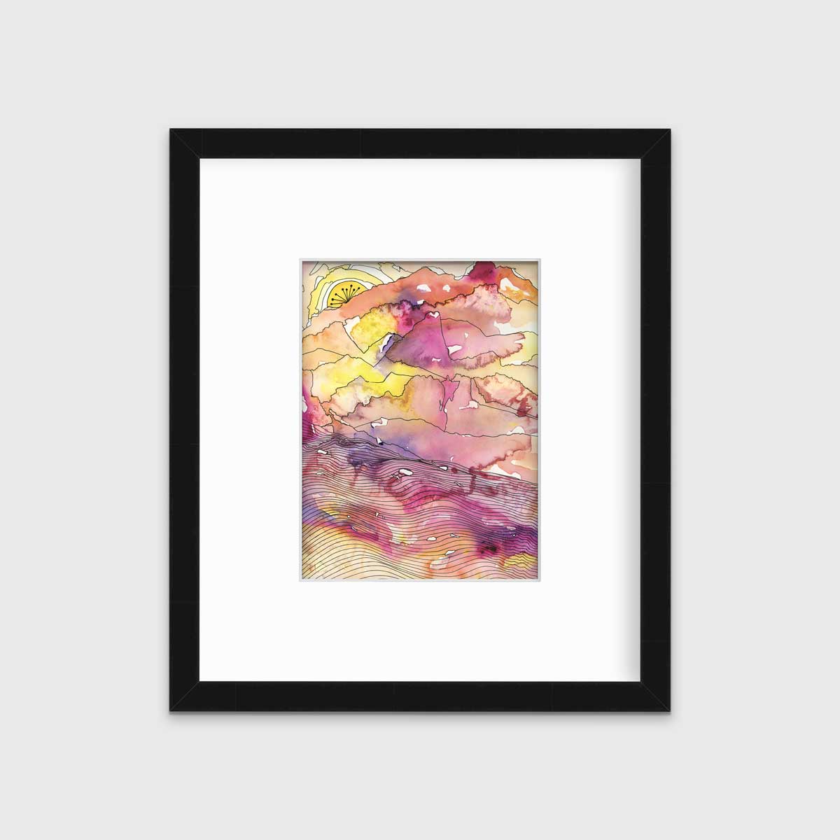 A yellow, pink, orange and black abstract landscape print in a black frame with a mat hangs on a white wall.