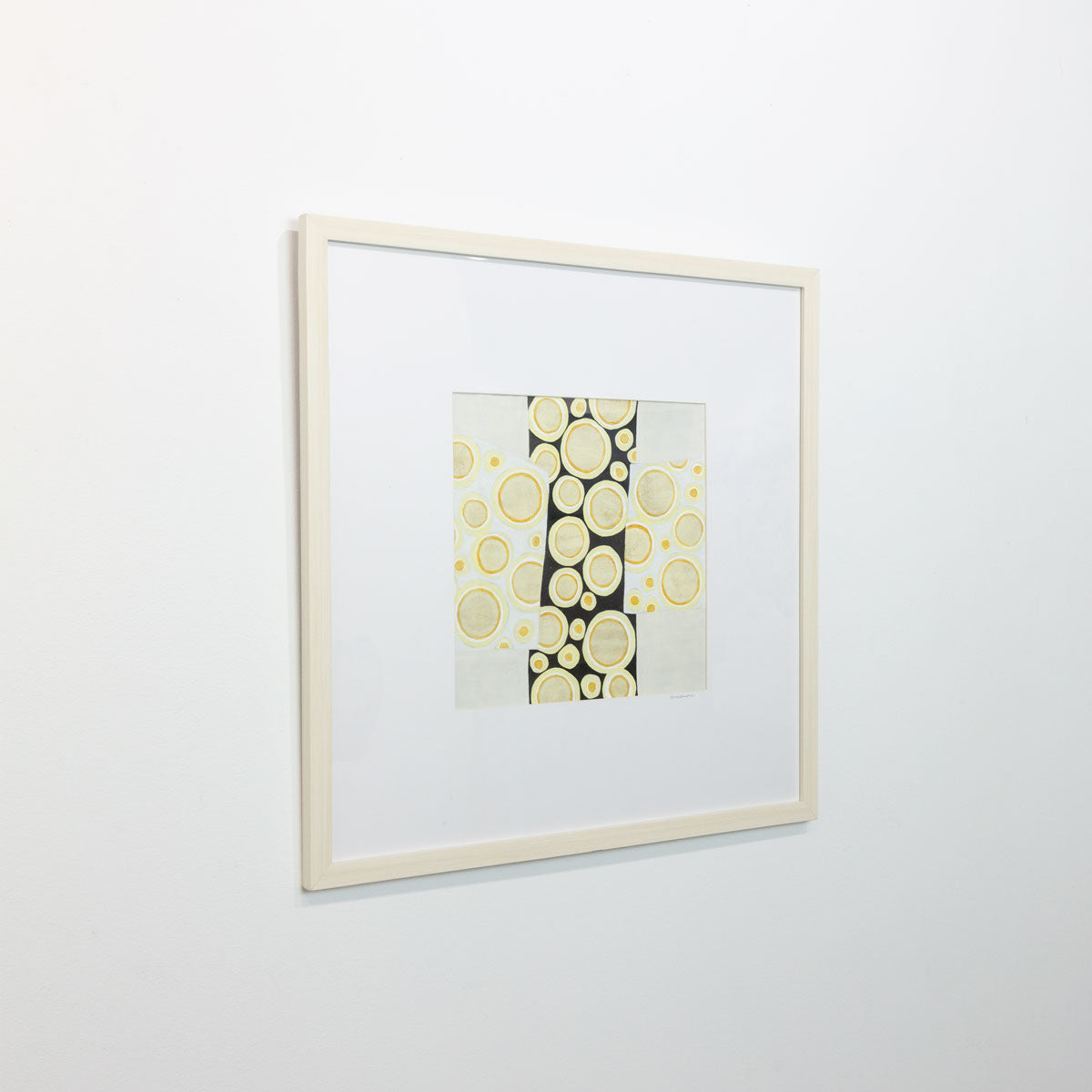 Bubbles #1 is seen at an angle hung on a gallery wall.
