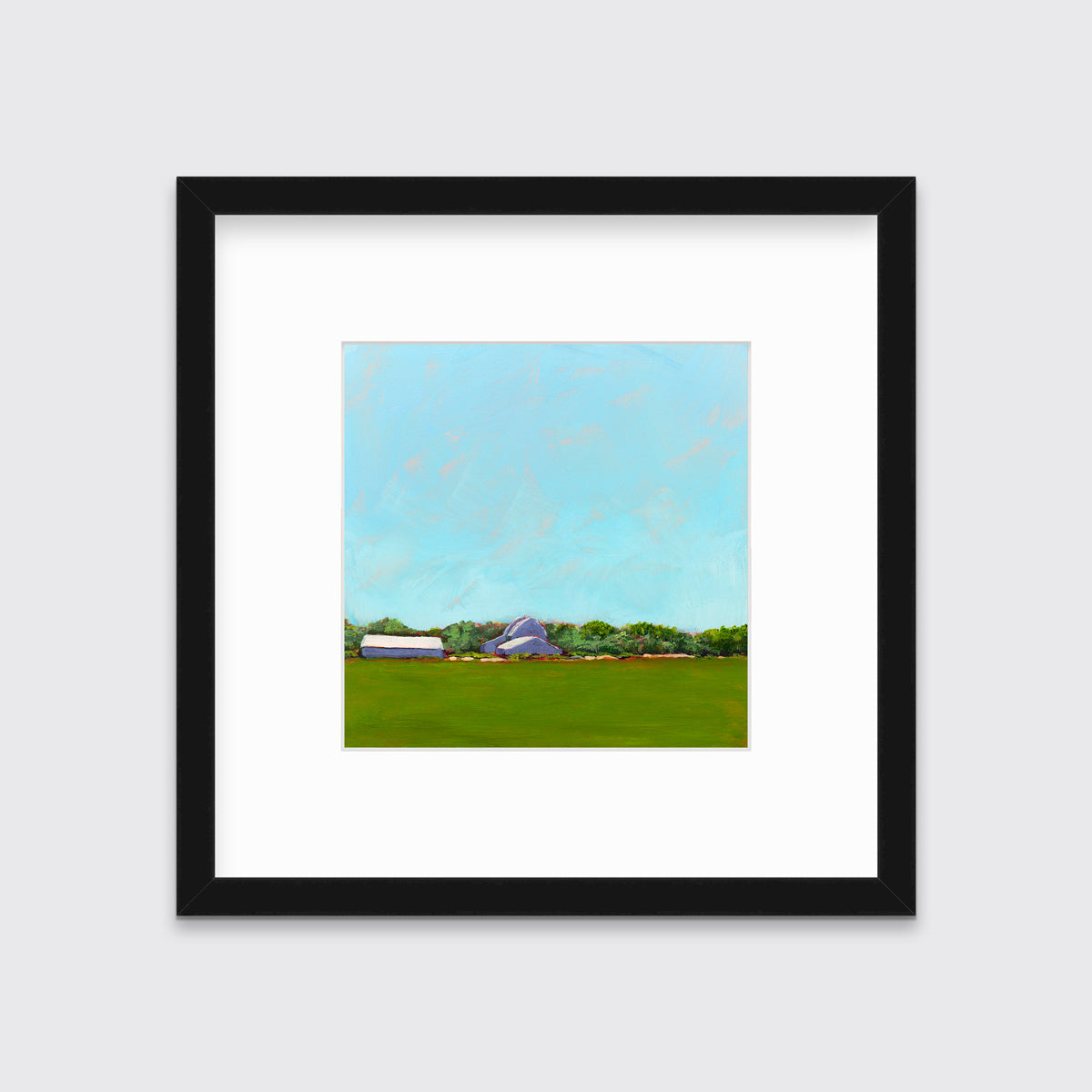 A blue, green, lavender and white landscape print in a black frame with a mat hangs on a white wall.