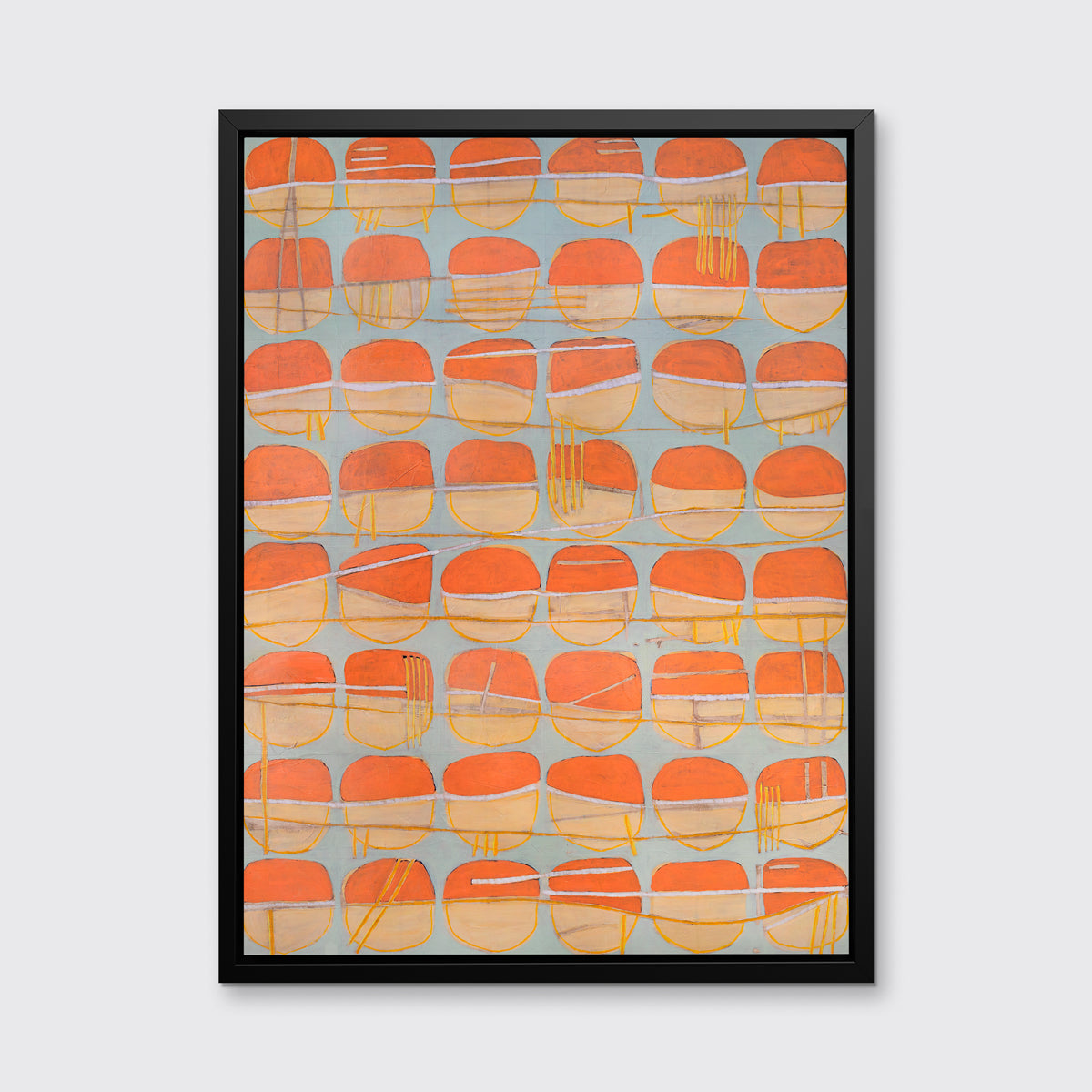 A orange, white and light blue abstract circle print in a black floater frame hangs on a white wall.