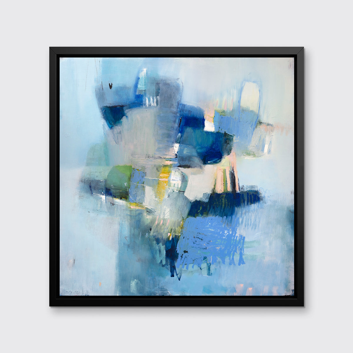 A blue abstract print in a black floater frame hangs on a white wall.