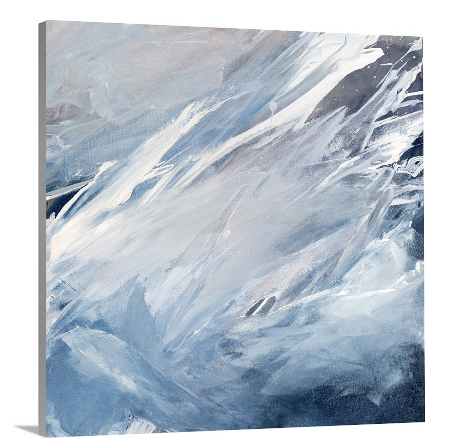 A side-angle view of a blue, grey, white and charcoal abstract print on canvas.