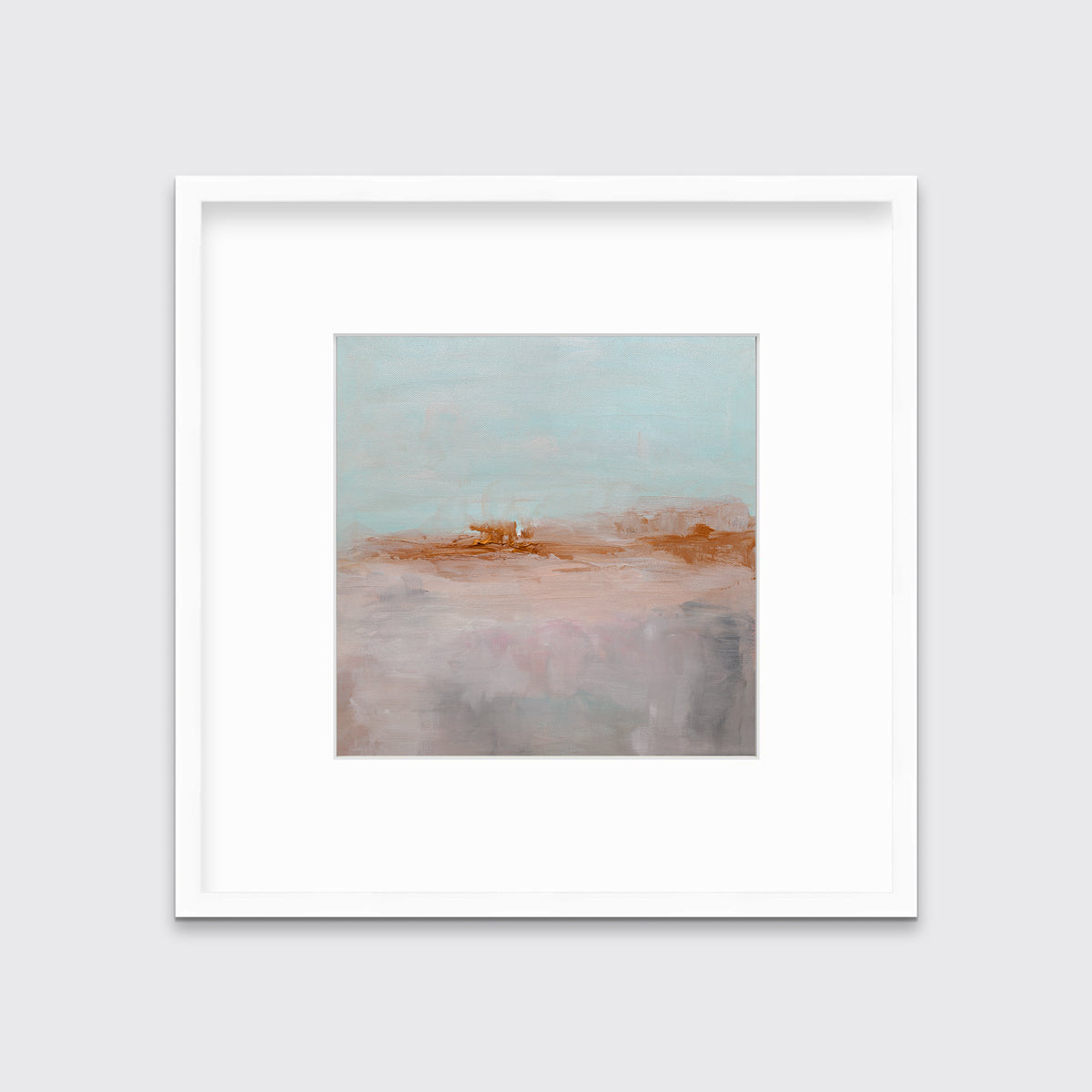 A teal, copper and dusty pink abstract print in a white frame with a mat hangs on a white wall.