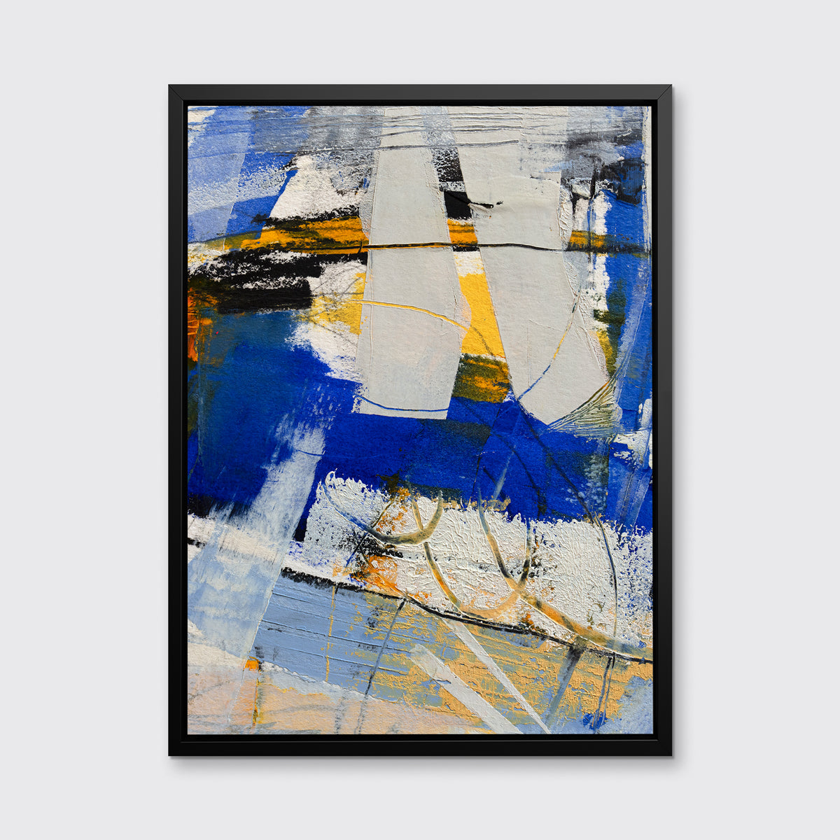 A blue, grey and yellow abstract print in a black floater frame hangs on a white wall.