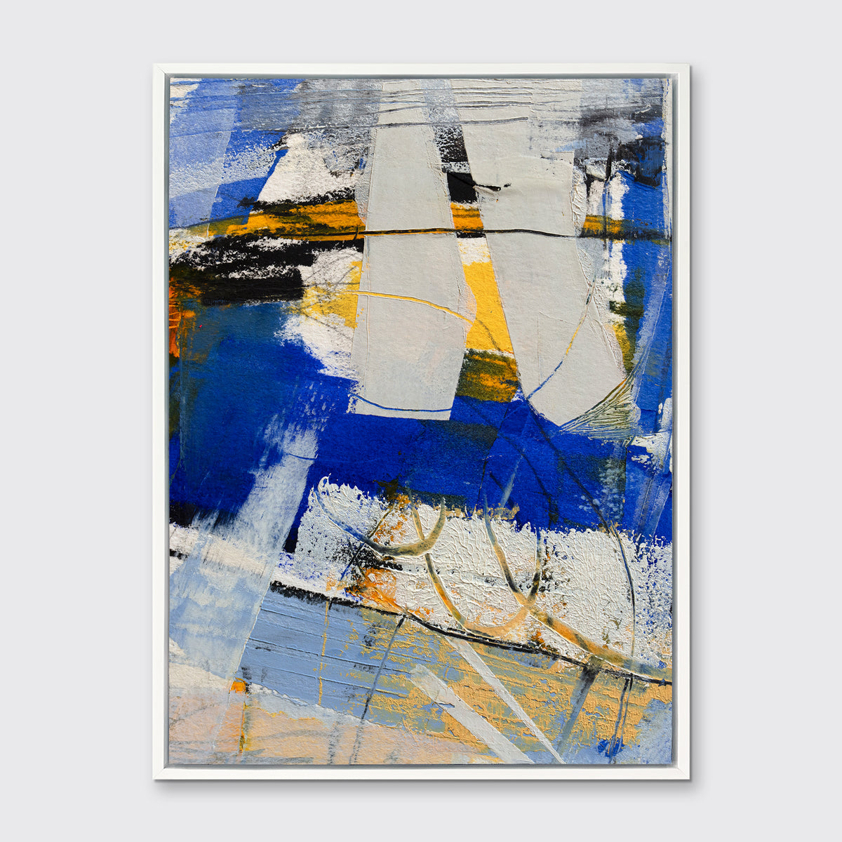A blue, grey and yellow abstract print in a white floater frame hangs on a white wall.