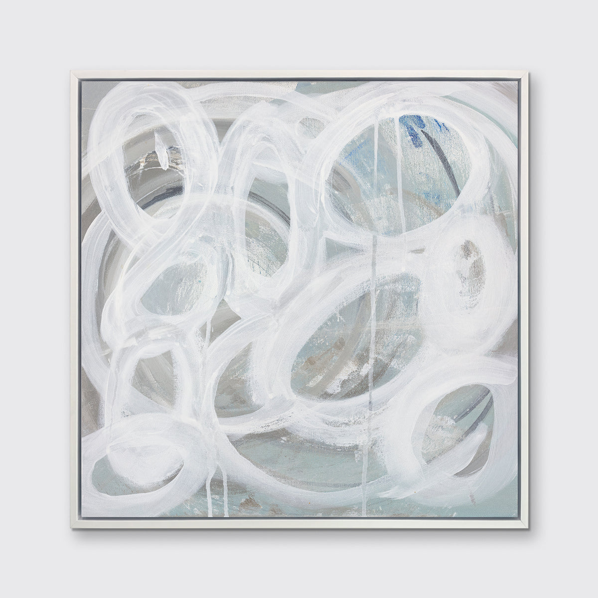 A white, light teal and grey abstract print in a white floater frame hangs on a white wall.