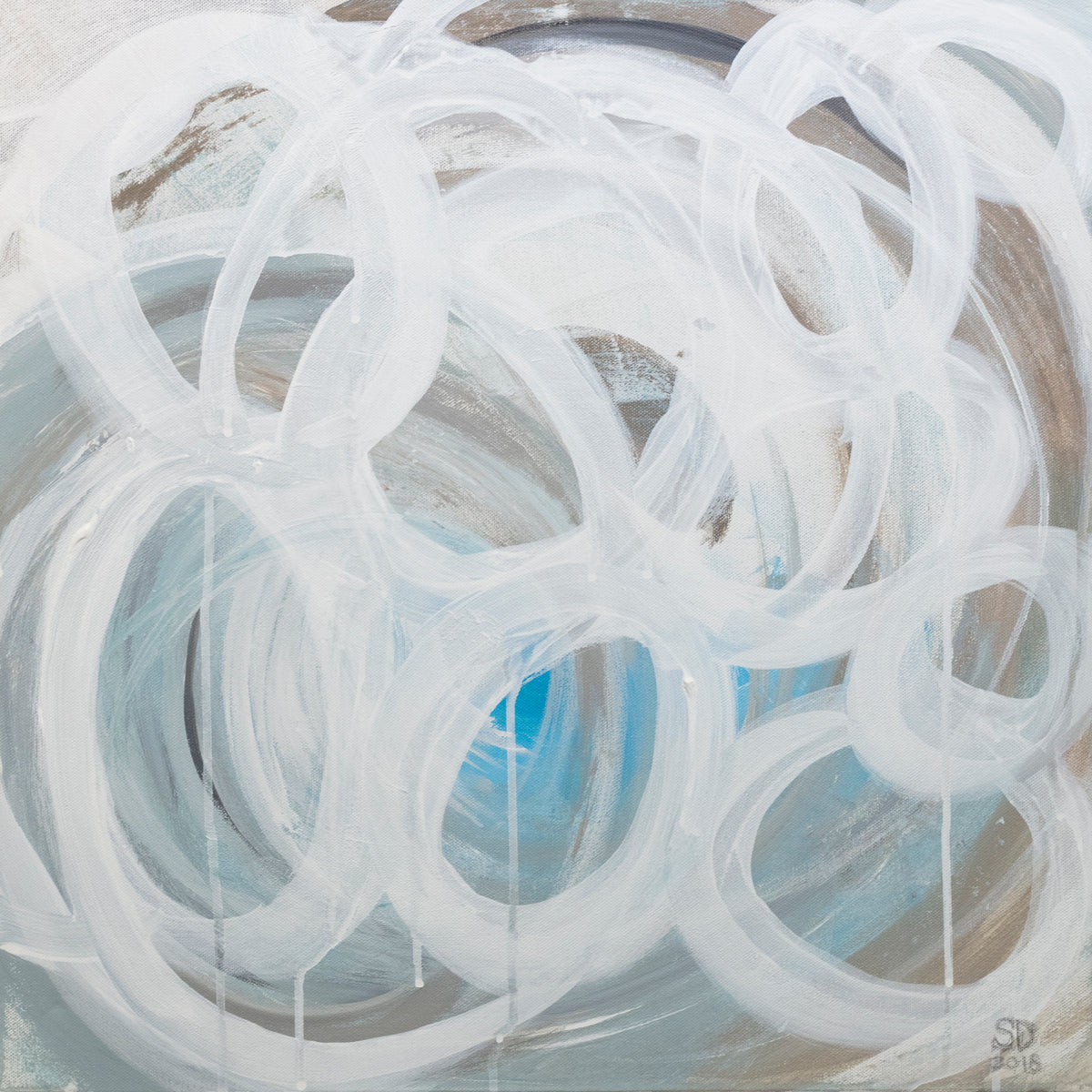 A grey, tan and blue painting with white concentric circles painted on it. Wired and ready to hang.