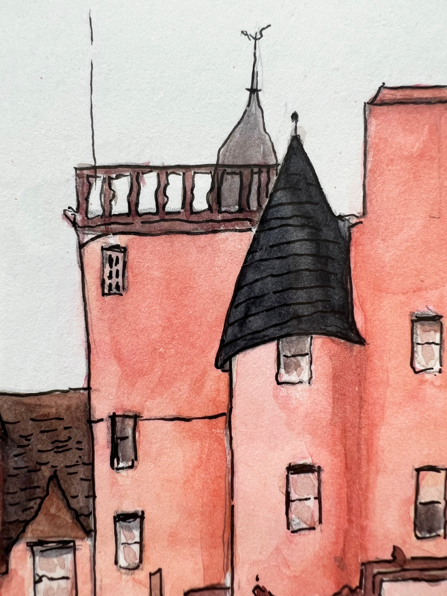 A close up view of the detail of pink, black and brown watercolor with black ink accents of the castle.