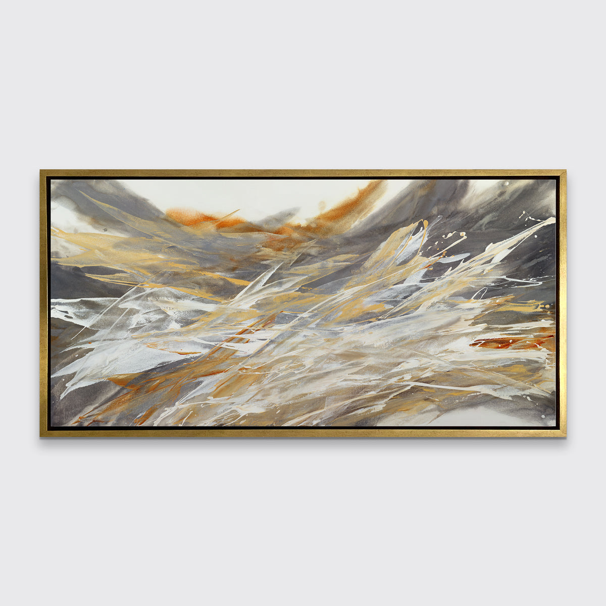 A gold, beige, white and grey abstract print in a gold floater frame hangs on a white wall.