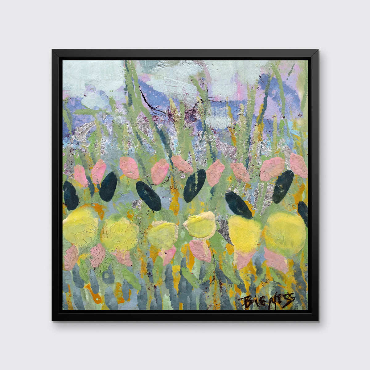 A green, yellow and pink abstract floral print in a black floater frame hangs on a white wall.