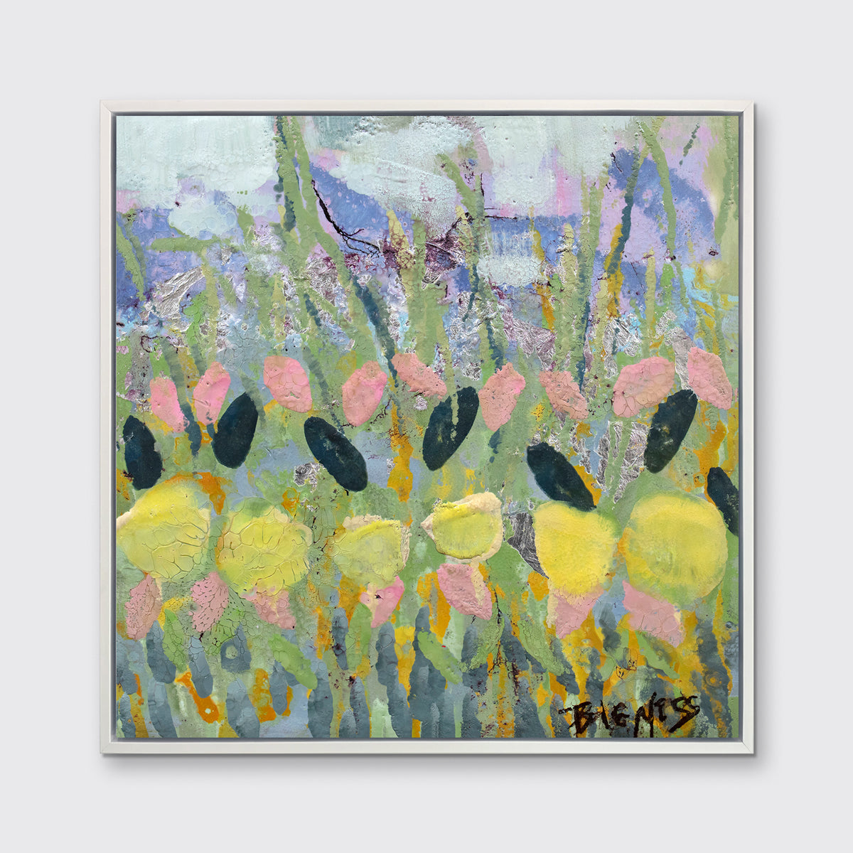 A green, yellow and pink abstract floral print in a white floater frame hangs on a white wall.