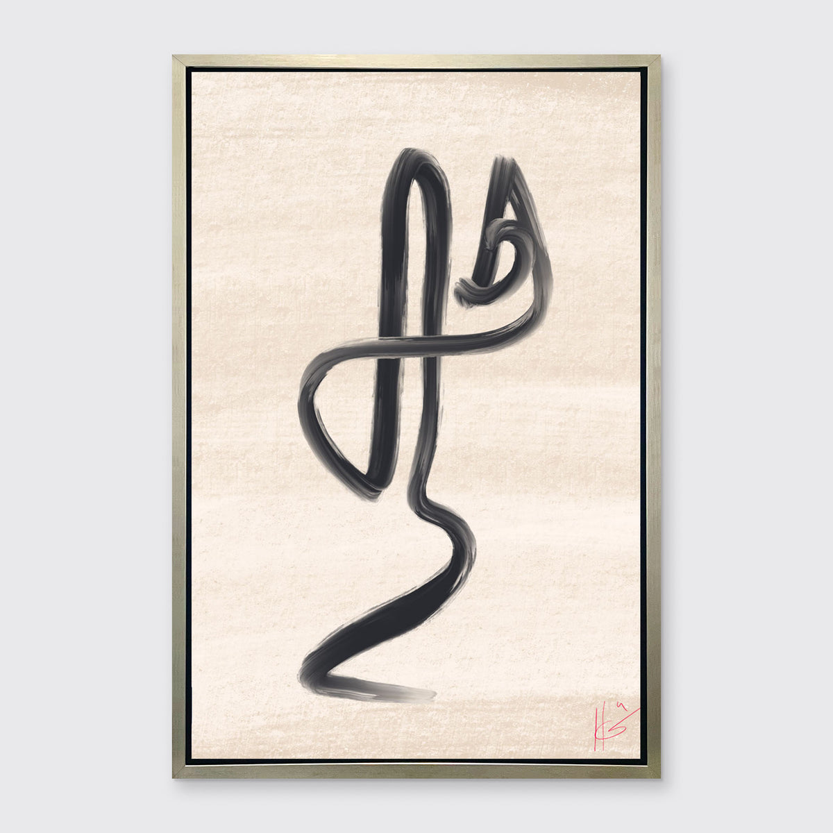A black and beige abstract print framed in a warm silver floater frame hangs on a light grey wall.
