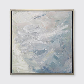 A white, blue, grey and light green abstract print in a silver floater frame hangs on a white wall.