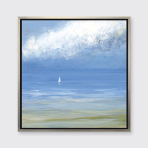 A blue, light green and white abstract seascape print with a small sailboat in a silver floater frame hangs on a white wall.