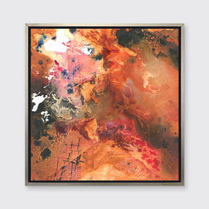 A red, orange, black and pink abstract print in a silver floater frame hangs on a white wall.