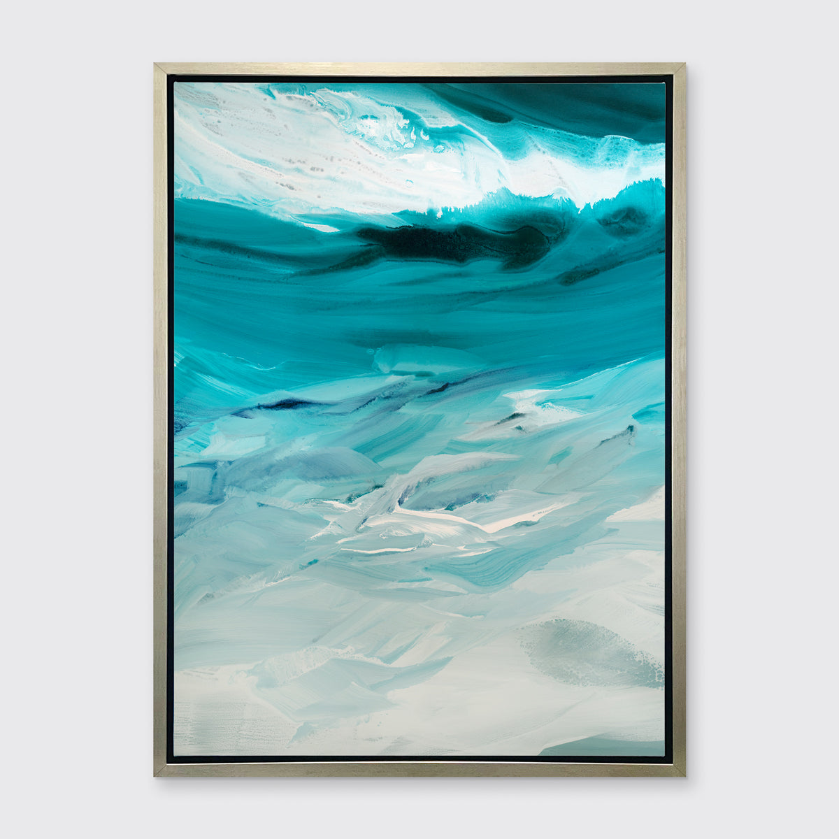 A teal, white and grey abstract print in a silver floater frame hangs on a white wall.