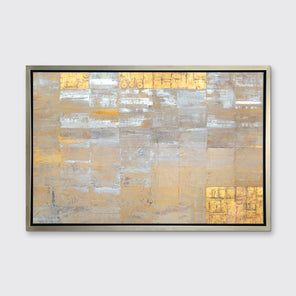 A grey, silver and gold abstract geometric print in a silver floater frame hangs on a white wall.