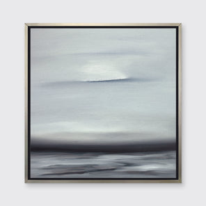 A tonal grey and black print in a silver floater frame hangs on a white wall.