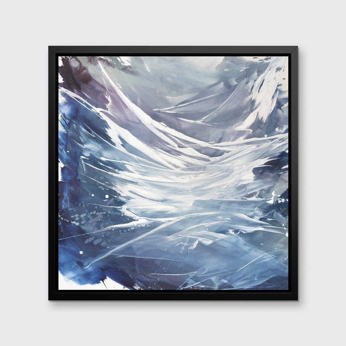 A light purple, grey, white and blue abstract print in a black floater frame hangs on a white wall.