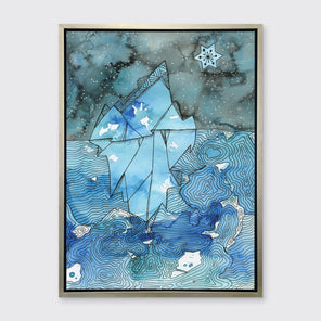 A blue illustration print framed in a warm silver frame hangs on a light grey wall.