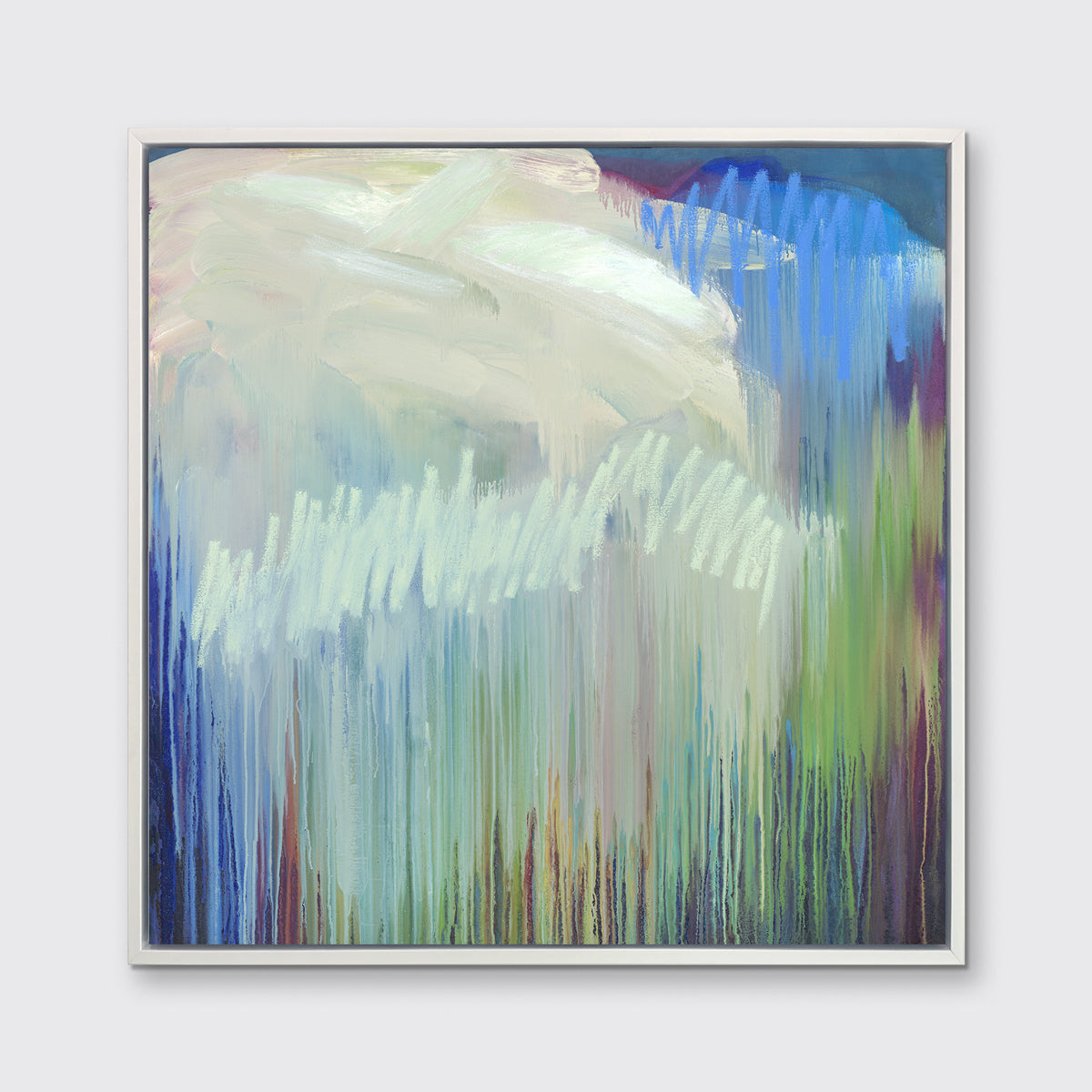 A multicolored abstract print in a white floater frame hangs on a white wall.