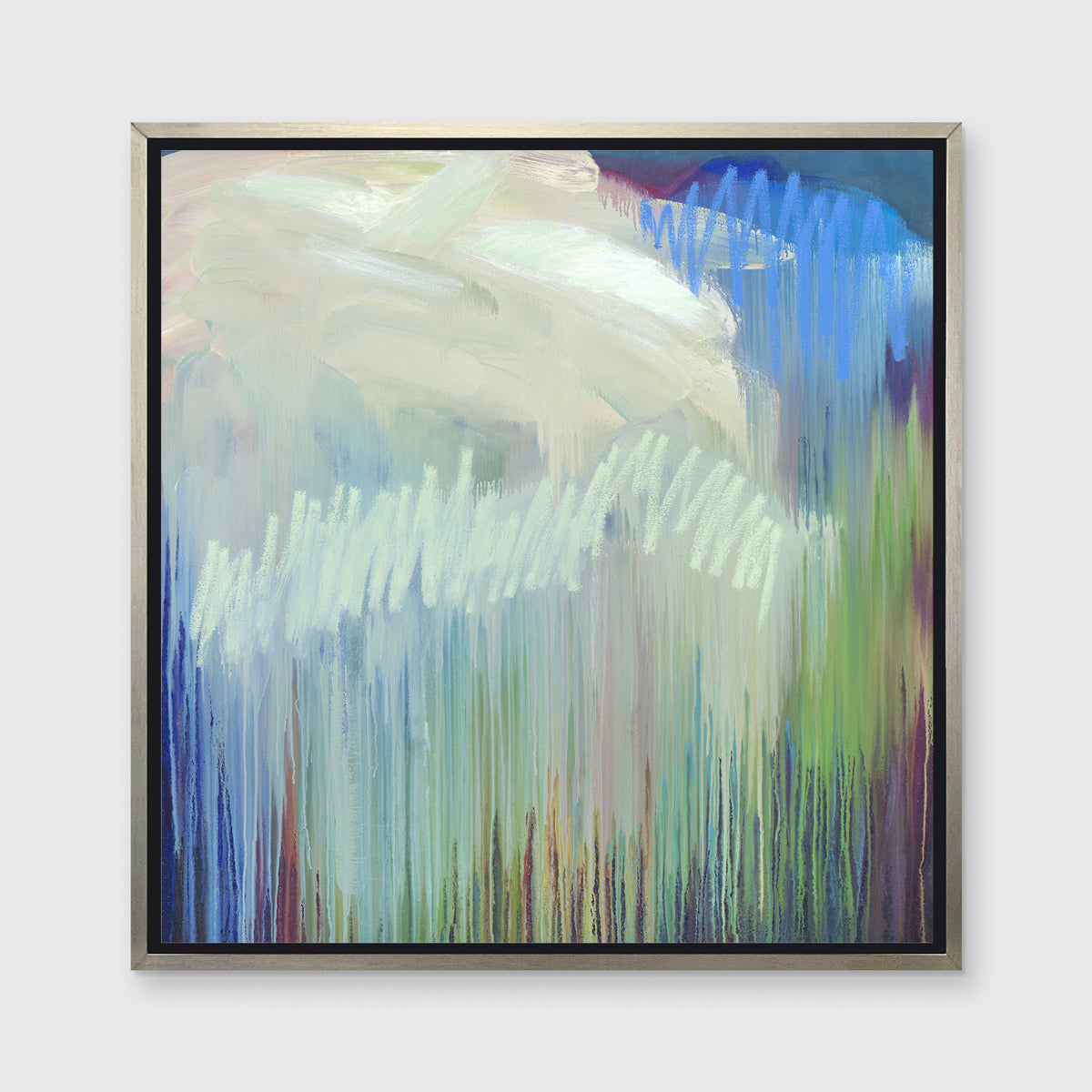 A multicolored abstract print in a silver floater frame hangs on a white wall.