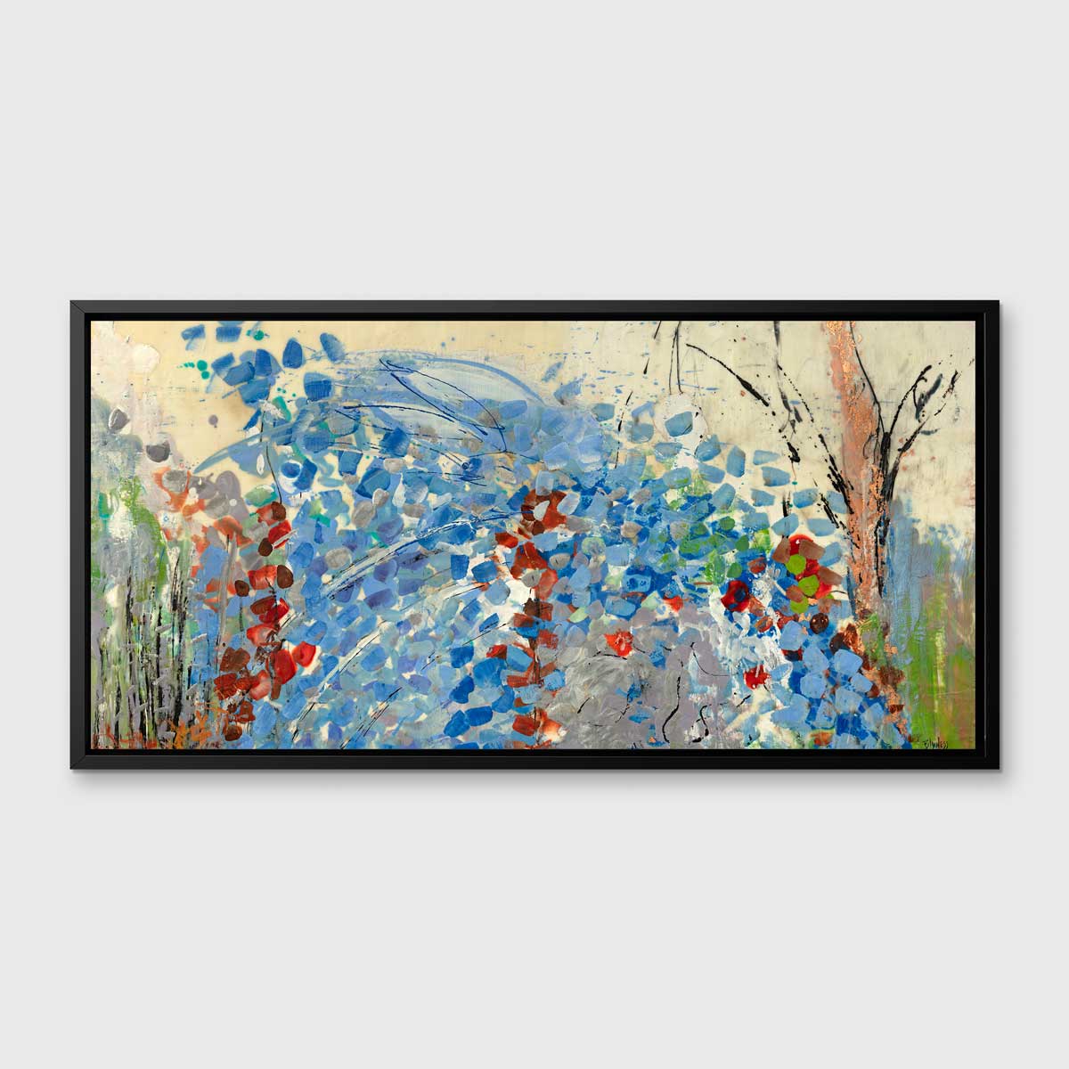 A blue, beige, green and black abstract print in a black floater frame hangs on a white wall.