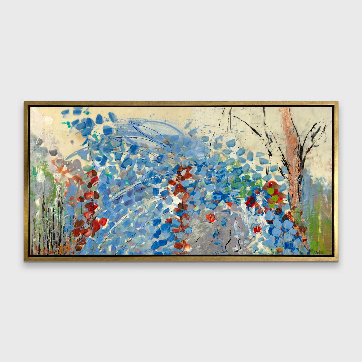 A blue, beige, green and black abstract print in a gold floater frame hangs on a white wall.