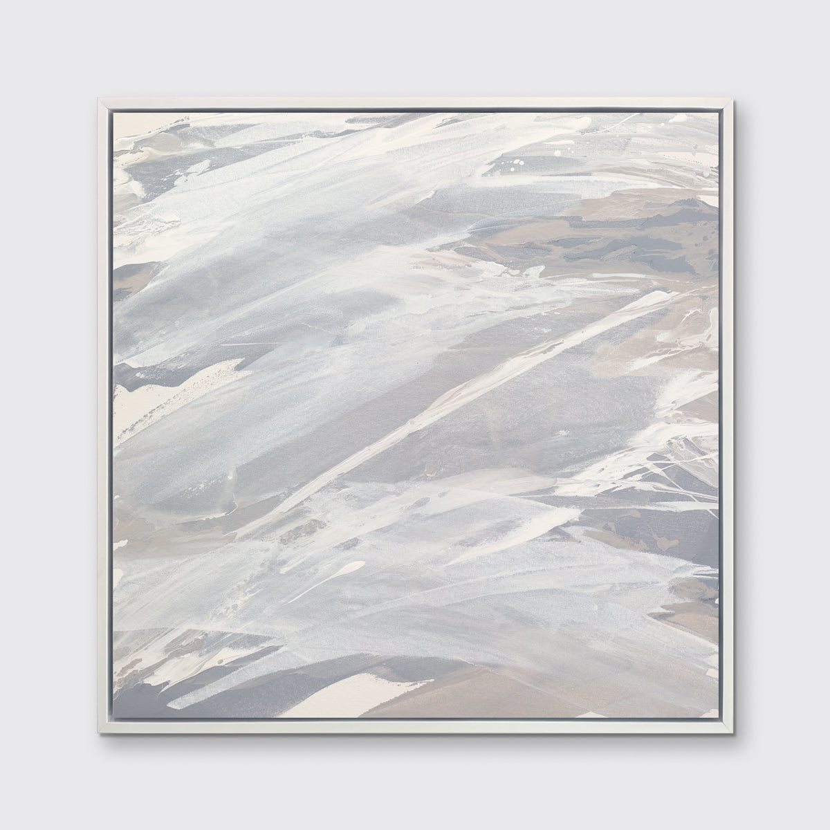 A grey, beige and white abstract print in a white floater frame hangs on a white wall.