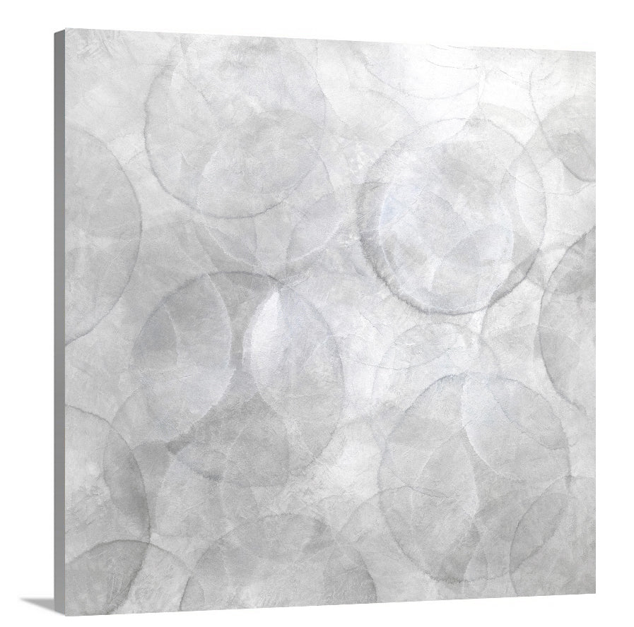 A side-angle view of a grey and white abstract geometric print on canvas.