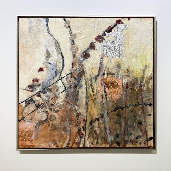 A nature-inspired abstract encaustic painting, framed in a thin, warm silver floater frame hanging on a white wall.
