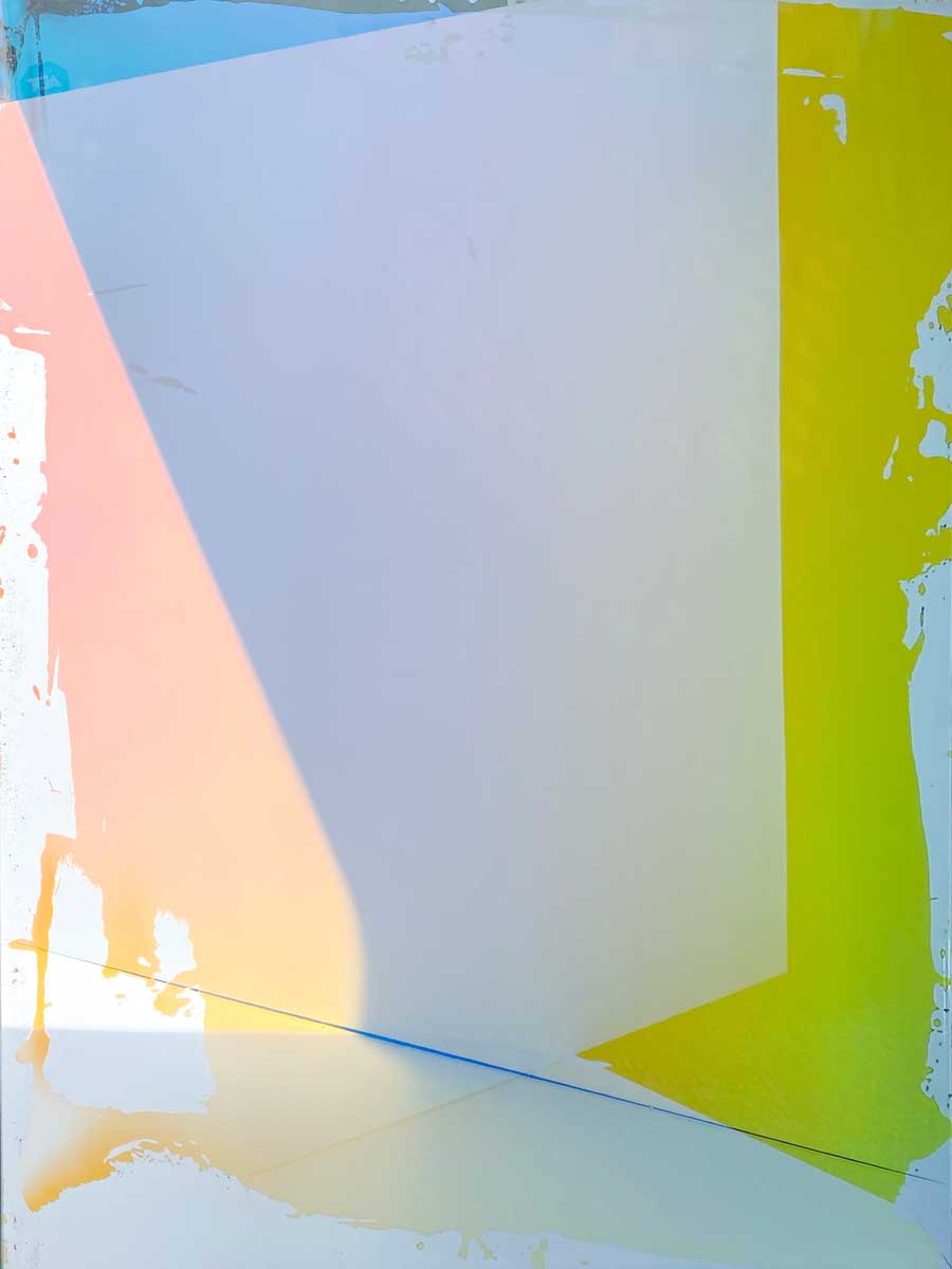 The multicolored surface of a fine art mirror by Alina B.