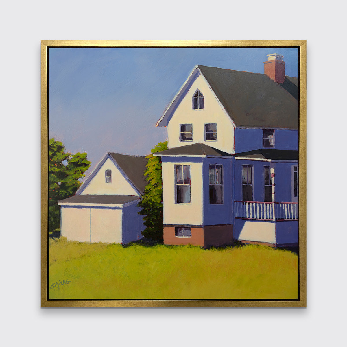 A blue, white and green contemporary house print in a gold floater frame hangs on a white wall.