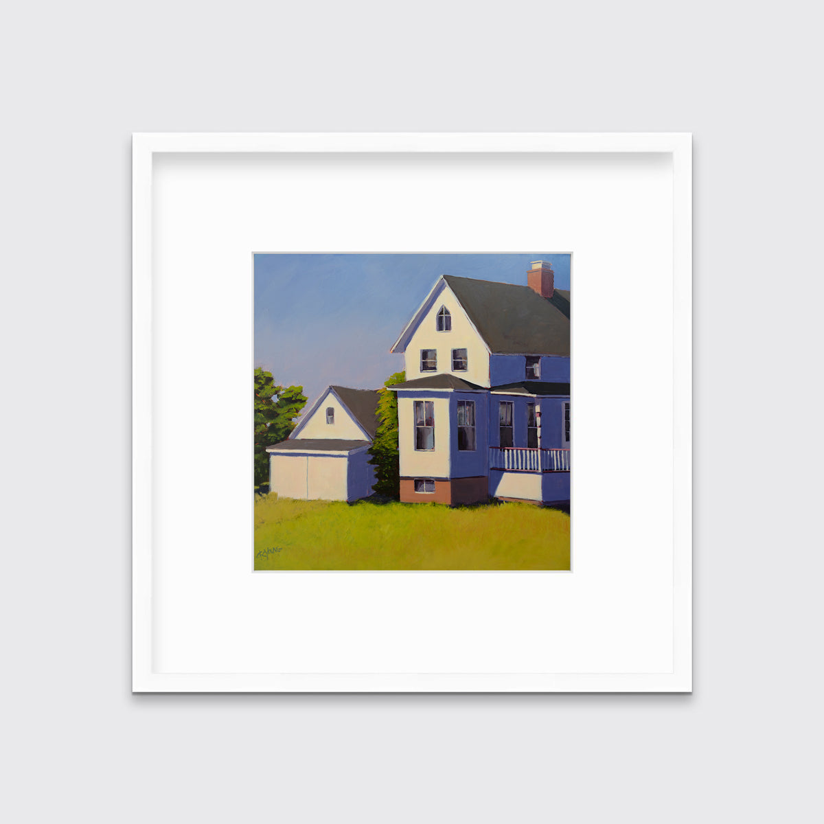 A blue, white and green contemporary house print in a white frame with a mat hangs on a white wall.