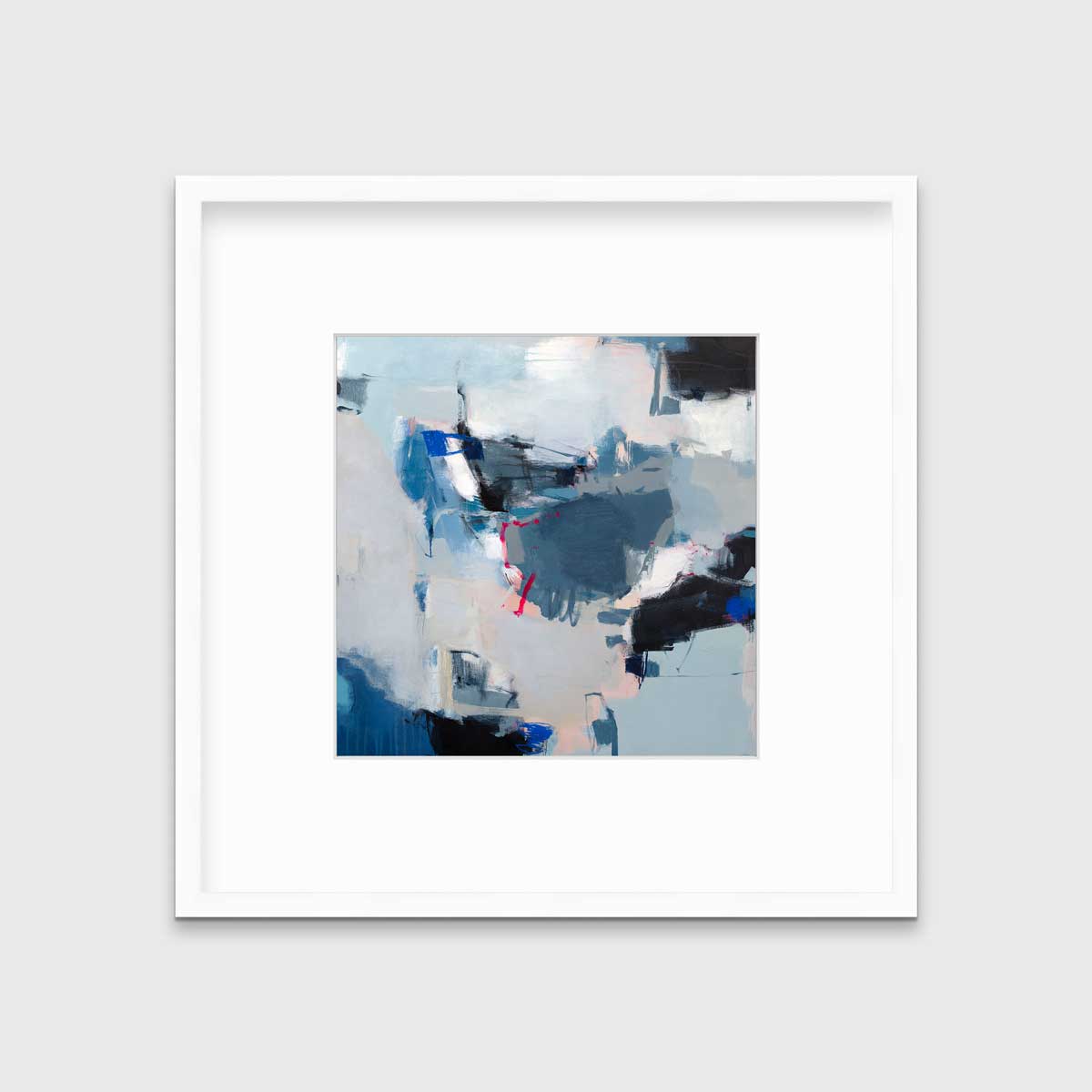 A blue abstract print by Kelly Rossetti in a white frame with a mat hangs on a white wall.