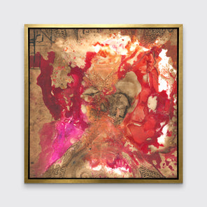 A gold, red and pink abstract print in a gold floater frame hangs on a white wall.
