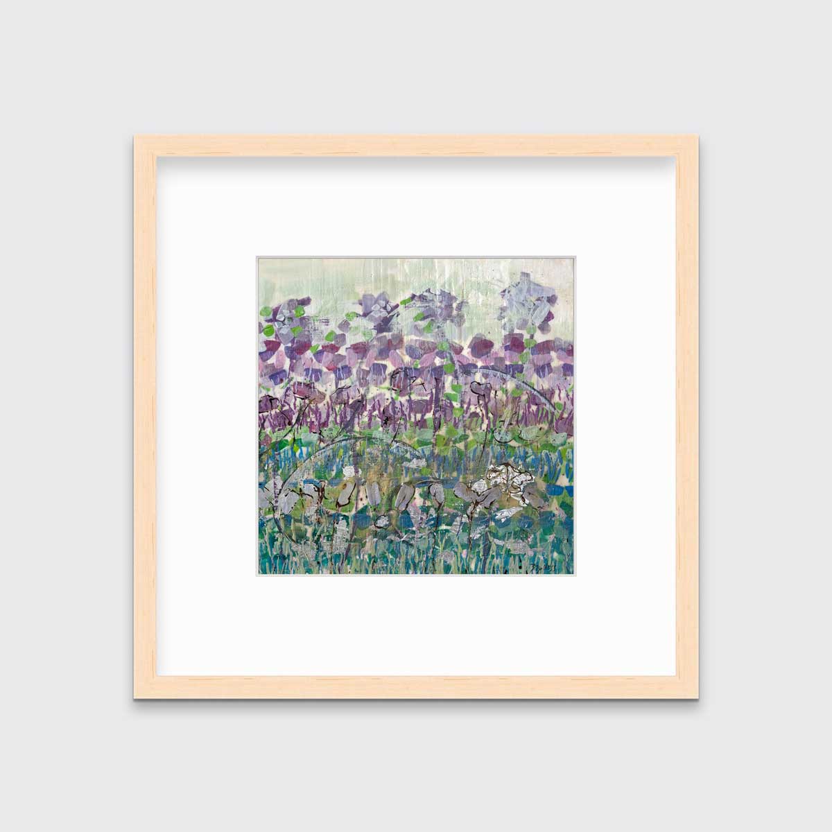 A purple, blue and green abstract floral print in a natural wood frame with a mat hangs on a white wall.