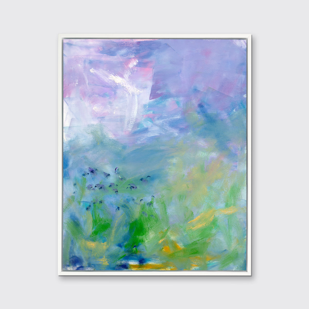 A blue, purple and green abstract print in a white floater frame hangs on a white wall.