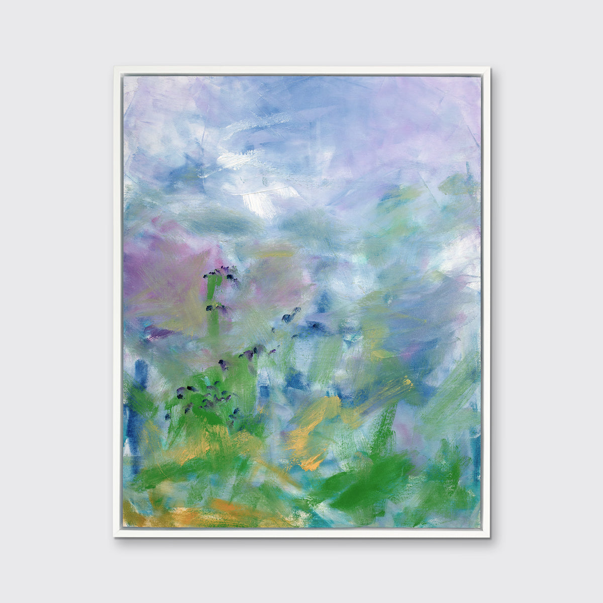 A blue, purple and green abstract print in a white floater frame hangs on a white wall.