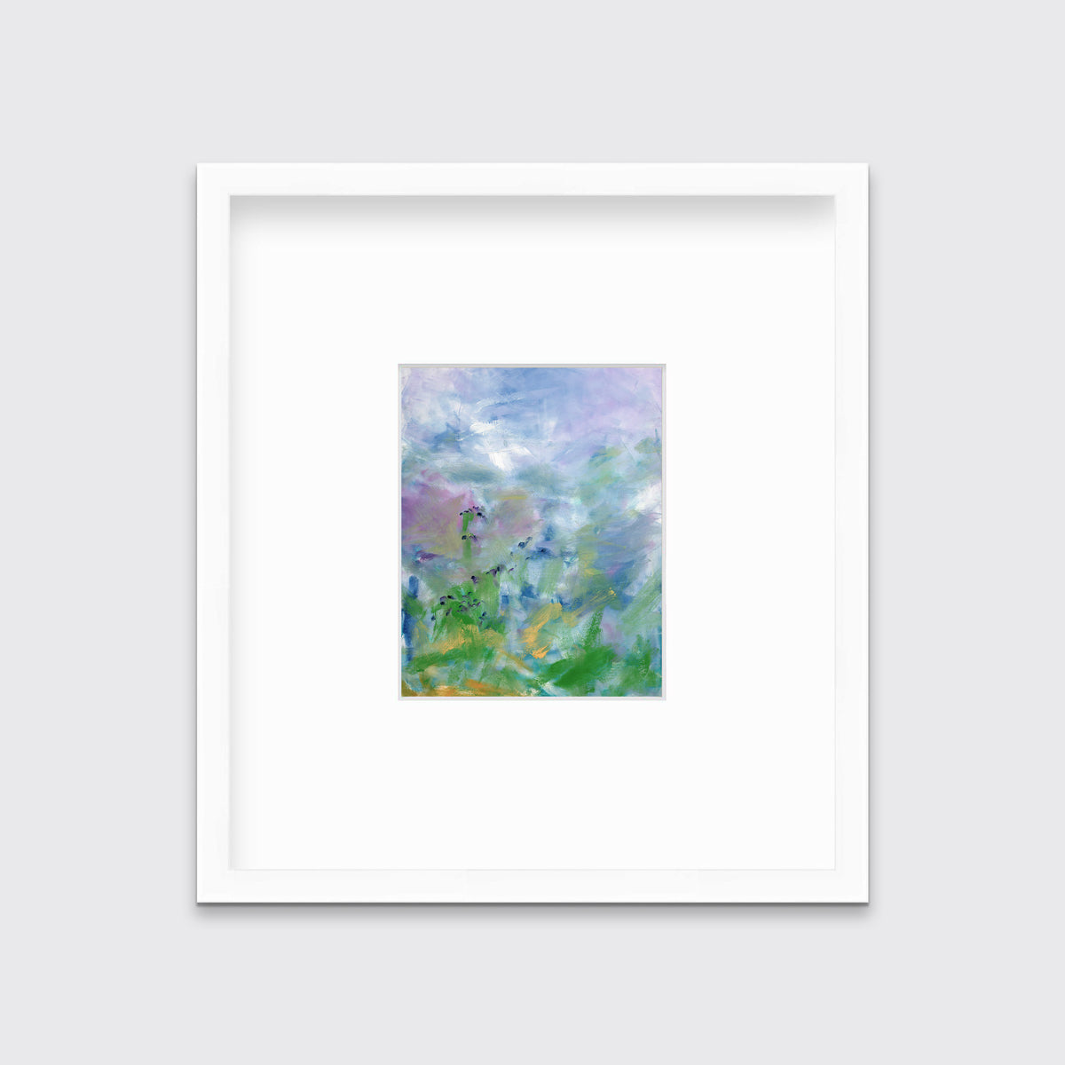 A blue, purple and green abstract print in a white frame with a mat hangs on a white wall.