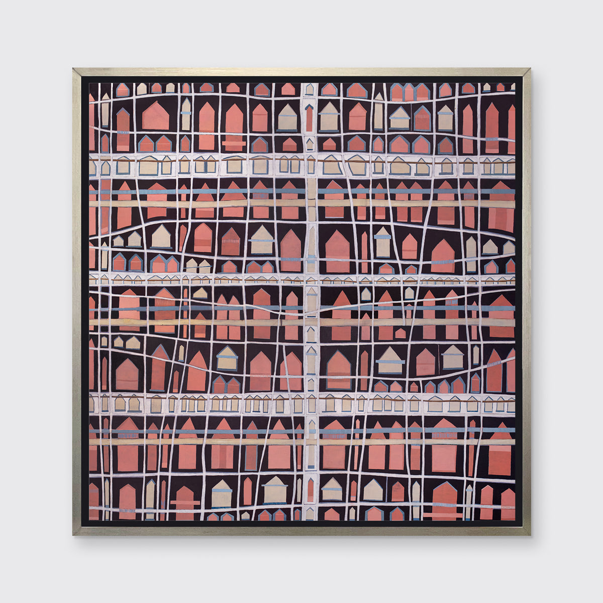 A pink, white and black abstract house print in a silver floater frame hangs on a white wall.