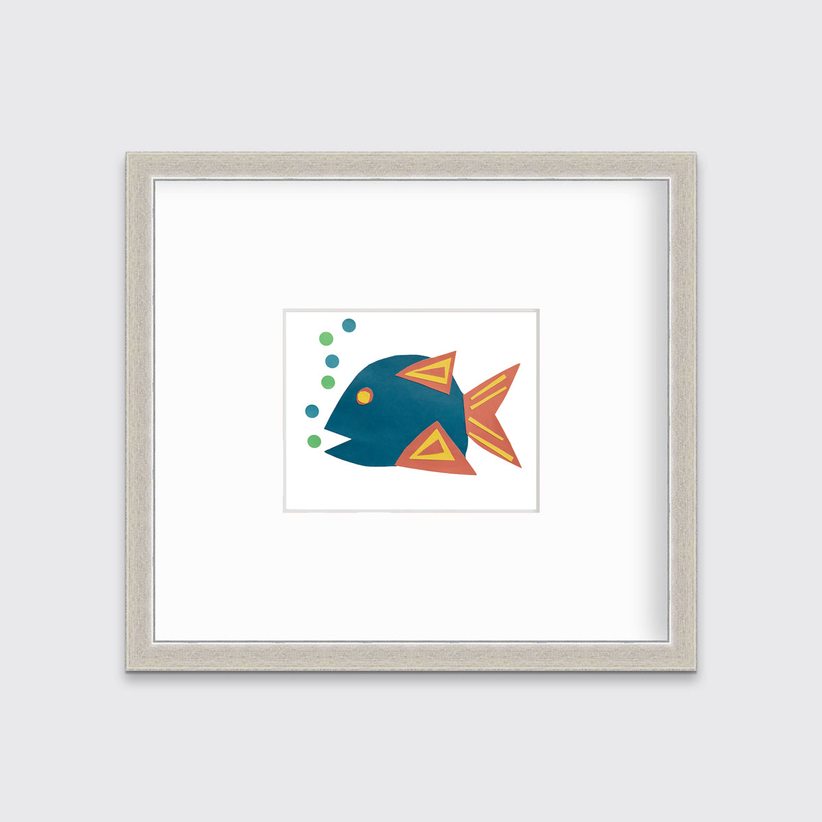 A print of a blue, orange and yellow fish. Matted in a silver frame.