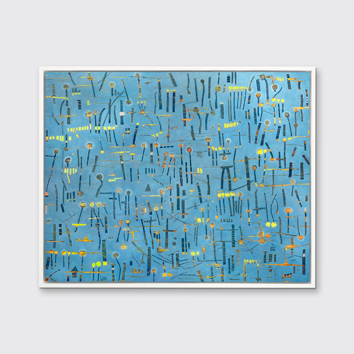A blue, yellow and orange abstract print in a white floater frame hangs on a white wall.